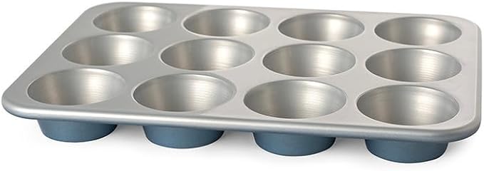 Nordic Ware Brilliant™ Colorful Bakeware 12 Cavity Muffin Pan, Nonstick made without PFAS or PTFE for safe cooking; Reinforced steel rim prevents warping
